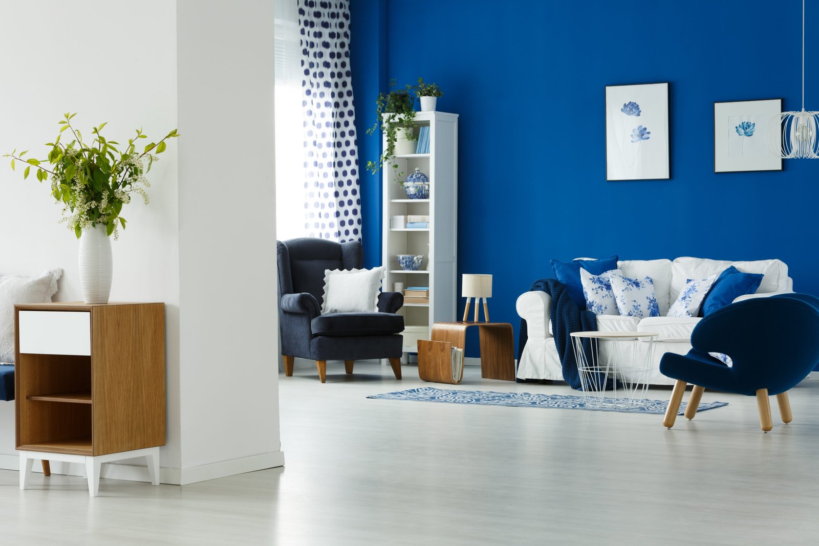 Bright living room with a blue painted wall